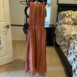 Sandro cutout dress. color is a muted terracota color with faint black stripes.